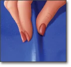 A close-up illustration of a hand with manicured nails pinching or gripping a piece of blue fabric, causing a visible crease.