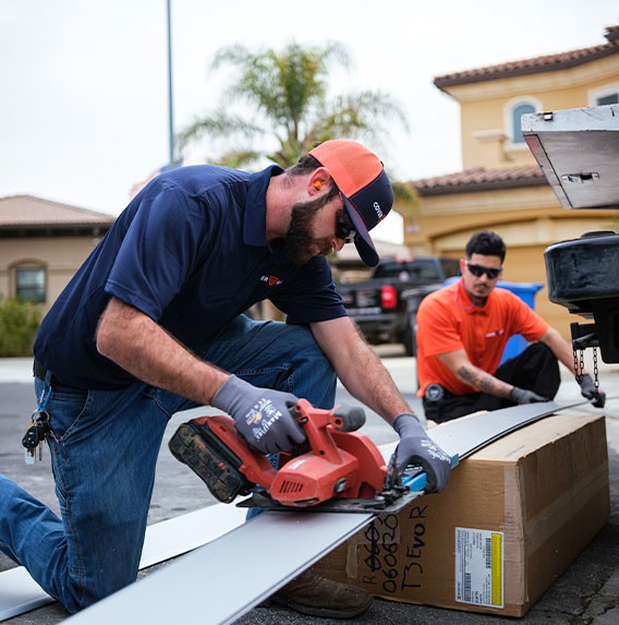 technicians installing pool cover system